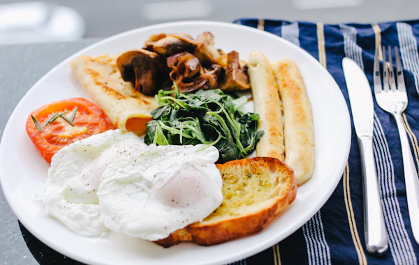 Breakfast plate with eggs, toast and vegetables